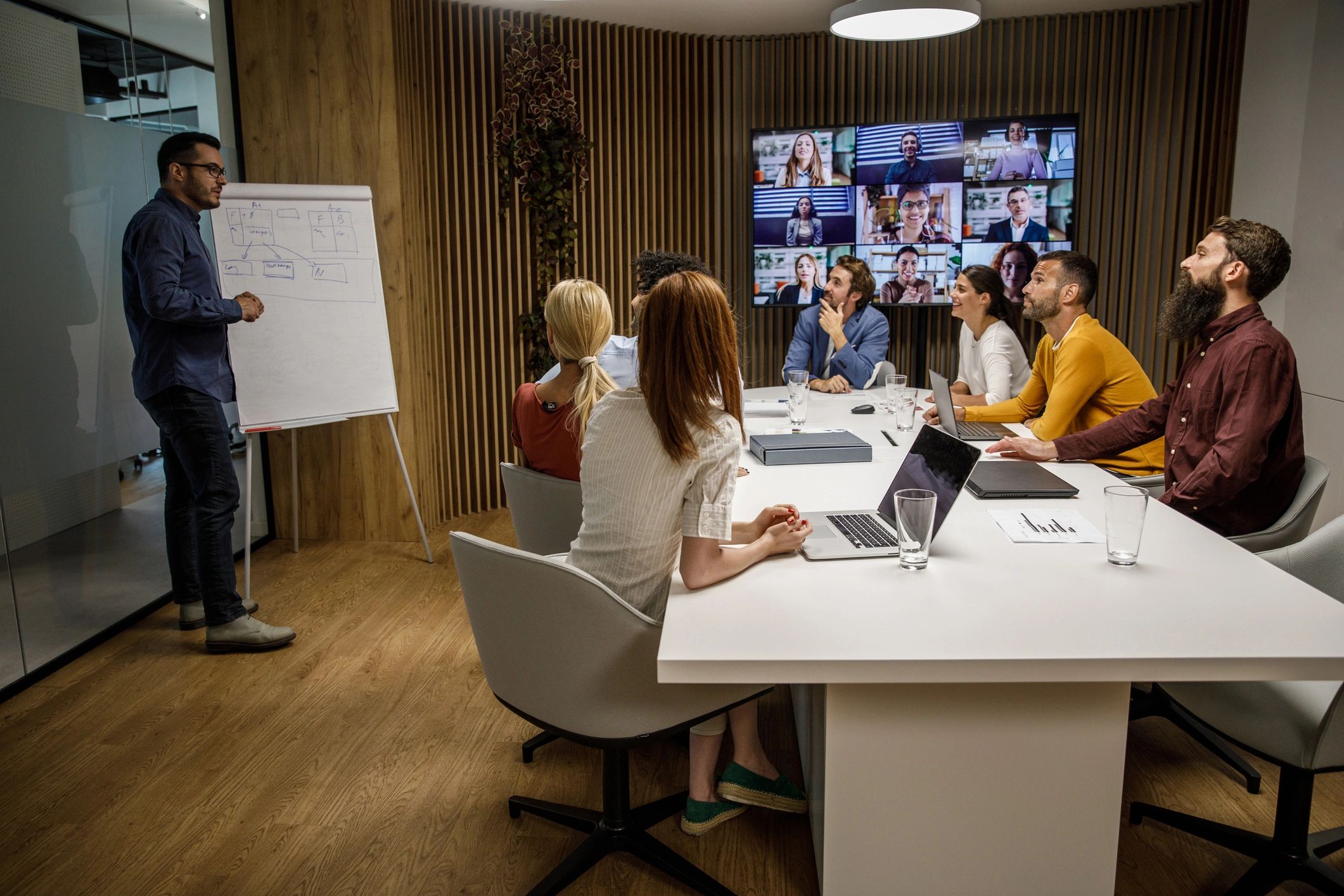 Presenter leading a professional hybrid meeting